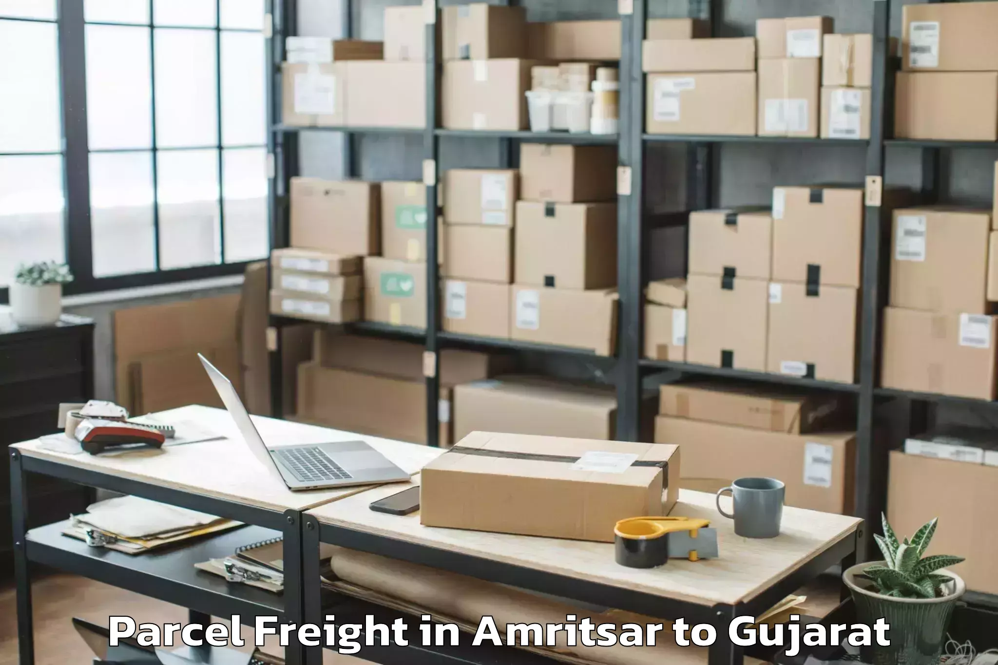 Easy Amritsar to Dwarka Parcel Freight Booking